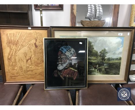 A framed painting on fabric of an Indian soldier together with a print and a framed tooled leather panel depicting a tiger.
