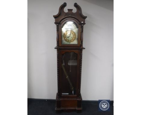 A Tempus Fugit longcase clock 