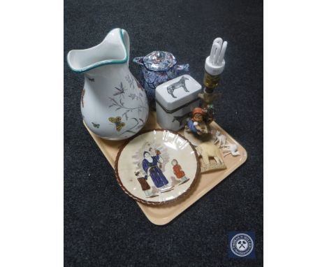 A tray of water jug, Ringtons chintz jug, Hummel table lamp, antique glazed plate depicting Father Christmas figure etc 