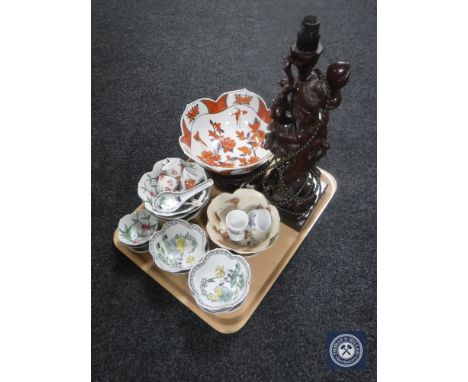A tray of Oriental wares including carved hardwood figured lamp, rice bowls, egg cups etc.