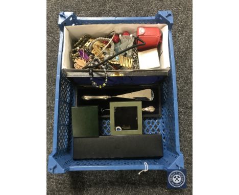 A basket of assorted costume jewellery, silver handled shoe horn and button hook