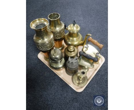 A tray containing two embossed brass vases, brass kettle, iron, candlestick etc 