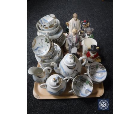 A tray of Japanese egg shell tea service together with six assorted figurines 