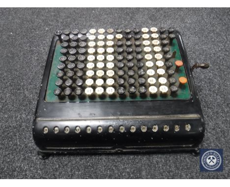 A vintage enamelled calculator