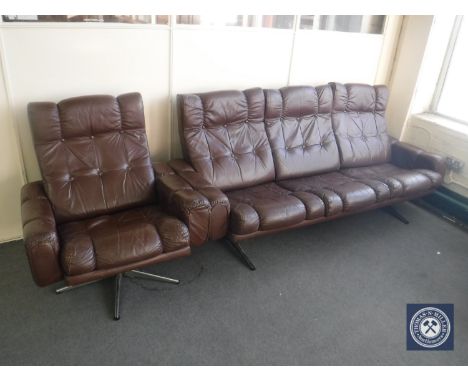 A mid 20th century brown button leather three seater settee and armchair 