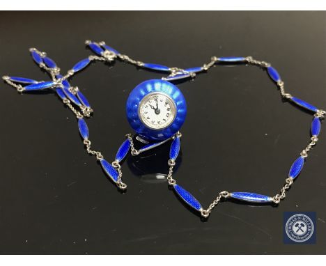 An early 20th century continental silver and guilloche enamel pendant ball watch on matching chain
