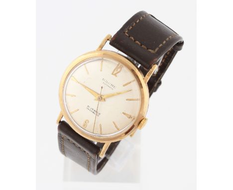 A 9ct yellow gold cased Baume Automatic wrist watch, the dial having hourly baton markers with 12 and 6 o'clock in Arabic num