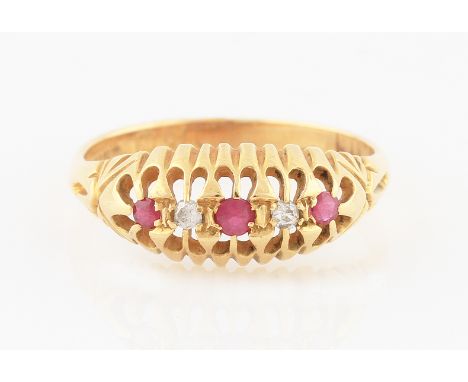 SOLD WITHOUT BUYERS PREMIUM AND VAT. An Edwardian style 18ct yellow gold ruby and diamond five stone ring, set with alternati