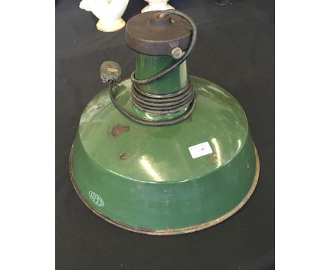 A green and white enamelled ceiling light.