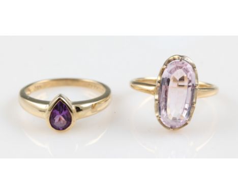 A 9ct yellow gold amethyst ring, rub over set with a pear cut amethyst, hallmarked Sheffield 2001, ring size O, weight approx