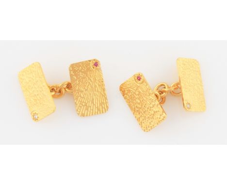 SOLD WITHOUT BUYERS PREMIUM AND VAT. A pair of 18ct yellow gold ruby and diamond set cufflinks, to each rectangular head eith