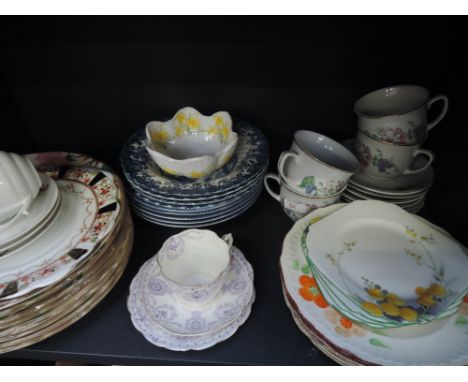 A shelf of ceramics including Shelley (dandelion), Blue and White