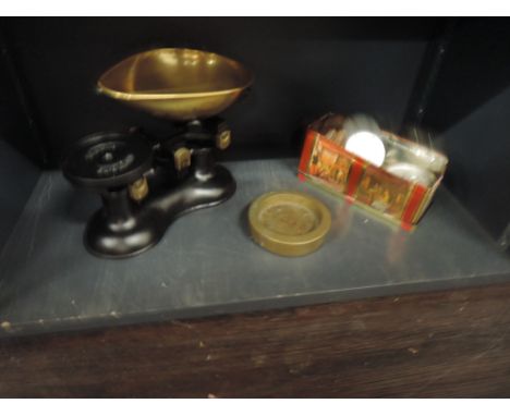 A cast and brass kitchen scale and weights