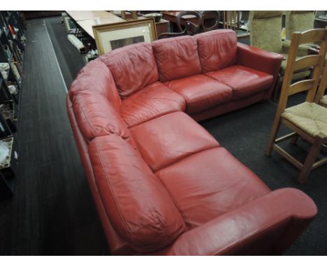 A vintage style red leather settee (complies with current fire regs)