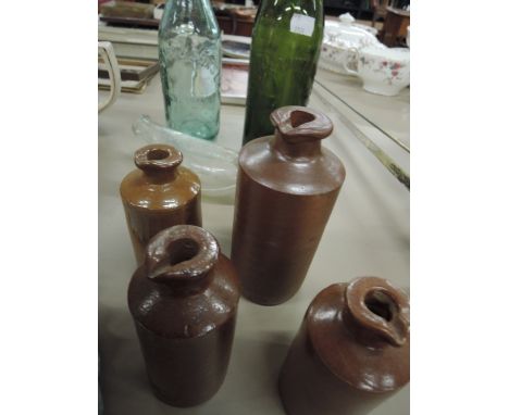 A collection of vintage bottles and stoneware bottles
