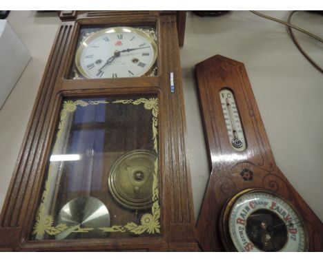 A mid 20th Century wall clock and a barometer