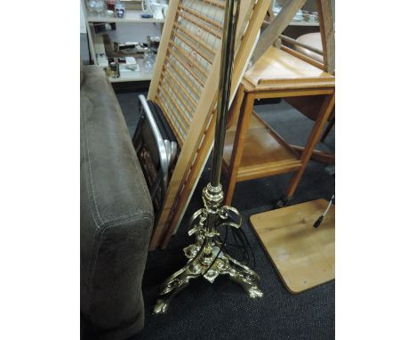 A modern brass standard lamp