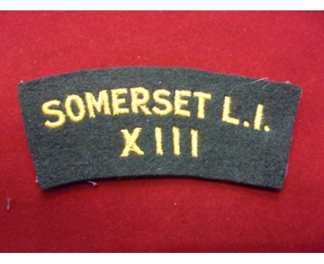British XIII Somerset Light Infantry cloth shoulder title, yellow on green backing 