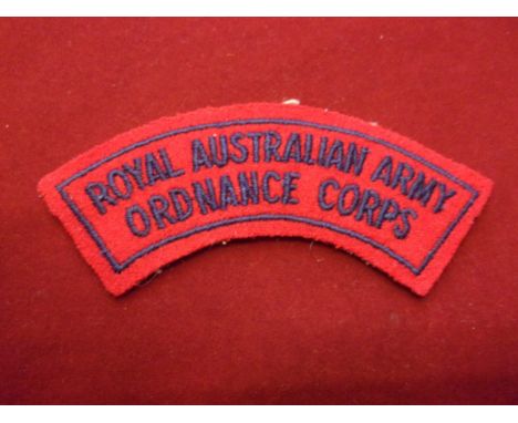 Australian Royal Army Ordnance Corps cloth shoulder title, blue on red