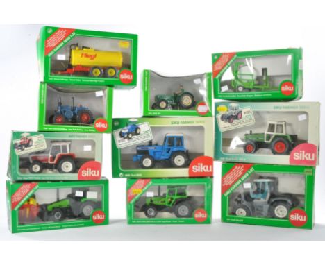 A group of ten Siku 1/32 farm issues comprising tractor and implements including Fendt Xylon, Ford 8830, Deutz Fahr 6. 61, St