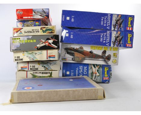 Twelve plastic model kits comprising mostly aircraft including Revell 1/48 scale issues. All appear to be complete. Boxes wit