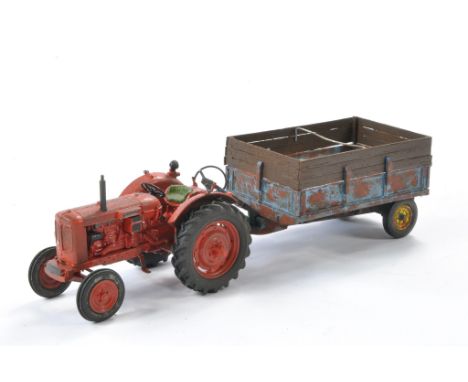 Farm Model Interest comprising a Scaledown Nuffield Tractor plus Trailer. Both are weathered. 
