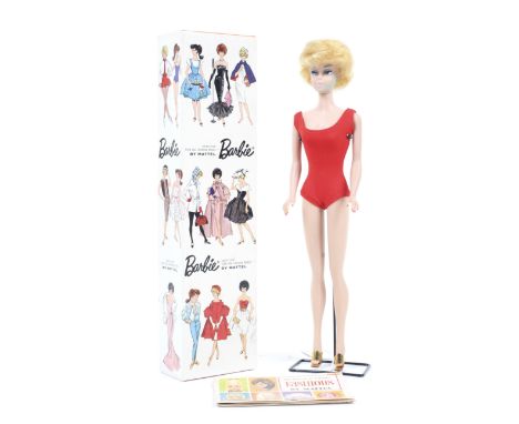 A Mattel 1960s Barbie doll. complete with outfit and booklet, in original box. 
