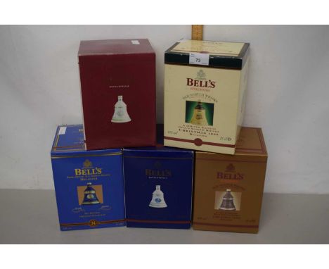 A group of five boxed Bells Old Scotch Whisky commemorative decanters