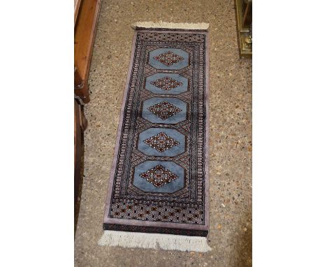 Small 20th Century machine made runner carpet with five blue lozenges
