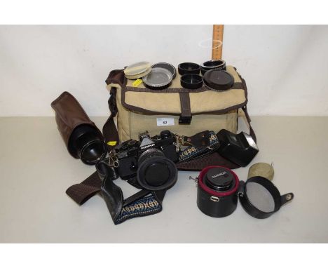 Mixed Lot: An Olympus OM10 camera together with further lenses, accessories and travel bag