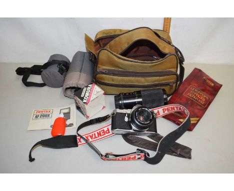 A Pentax ME Super camera together with lens and accessories and padded travel bag