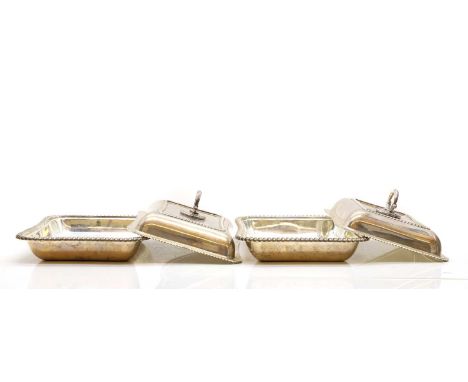 A pair of Edwardian silver entrée dishes and covers, London 1902, by William Hutton and Sons Ltd, with silver plated handles2