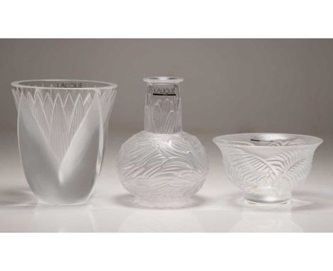 A Lalique 'Thebes' glass vase, 12cm high, a 'Kelpa' glass coupe, 11.5cm diameter, and a'Plumes' vase, 13cm high, all with 'La