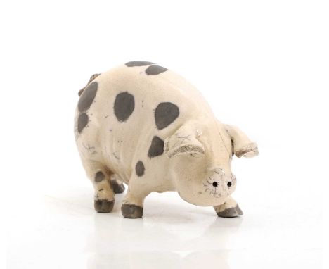 ▲ Lawson Rudge (b.1936), a raku glazed model of pig, incised,25cm wide9cm deep12cm highCondition ReportGrazing thoughout.