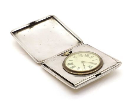 A silver cased travelling clock London 1910, makers mark for Cohen &amp; Charles, the case with mounted keyless wind 8-day po
