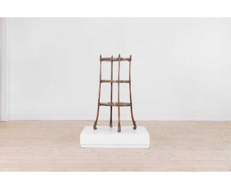 A Victorian satinwood and walnut three-tier étagère, c.1890, decorated in the French taste, each graduated oval shelf with a 