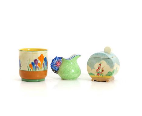 A group of Clarice Cliff pottery items c.1930, comprising a 'Crocus' pattern vase, 9.2cm high, a Bonjour shape preserve pot a