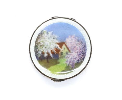 A silver and enamel box and cover by Cohen &amp; Charles, London import 1920, enamelled with a cottage scene, with a gilt int
