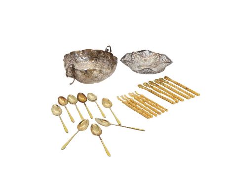 A cased set of nine silver gilt and enamel teaspoons, Birmingham 1929, with yellow enamel handles 10cm long, together with a 