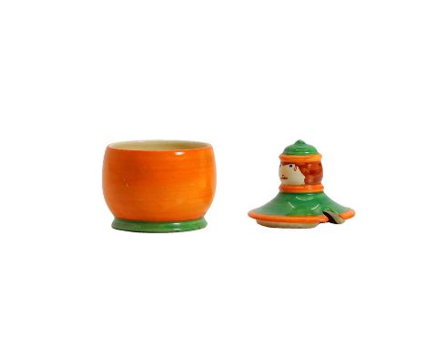 A Clarice Cliff 'Dutch Boy' potter preserve pot and cover, c.1930, painted in green and orange, printed marks,11cm high