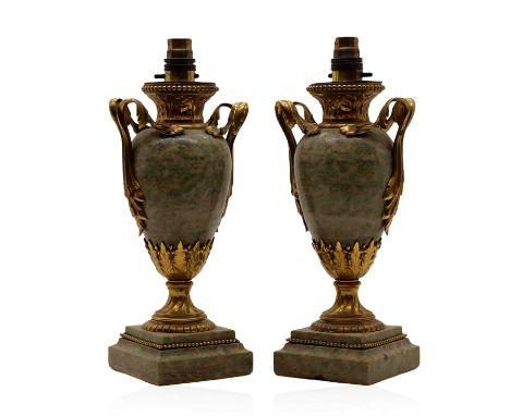A pair of gilt bronze mounted marble urn lamps, 19th century, later converted, each raised on a swept square plinth,total 32.