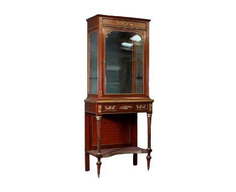 A Louis XVI style mahogany and gilt bronze mounted cabinet on stand, early 20th century, with a shaped and bevelled glass fro