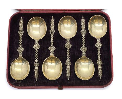 A cased set of Victorian six silver gilt apostle spoons, by Holland, Son &amp; Slater, London 1881, with twisted foliate hand