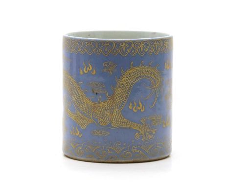A Chinese porcelain brush pot,  20th century, of cylindrical form, painted with a dragon chasing a flaming pearl in gilt agai