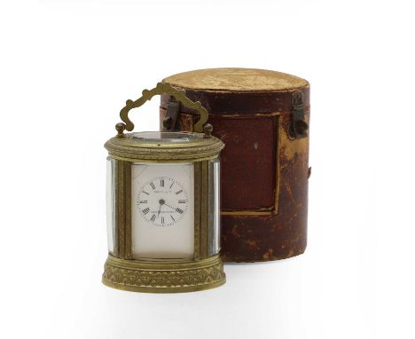 A cased brass carriage timepiece, c.1900, French, the dial inscribed 'Martin &amp; Co Paris &amp; Cheltenham', with a single 