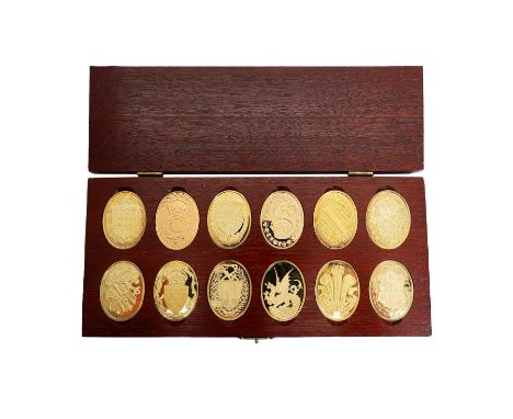 Danbury Mint 'The Arms Of The Prince And Princess Of Wales', 'a collection of their heraldic devices', cased set of twelve si