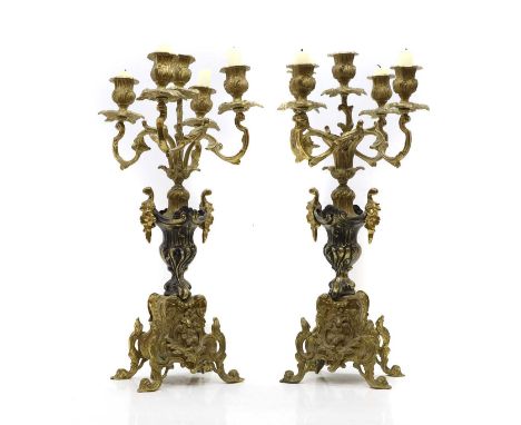 A pair of brass five-light candelabra, 19th century, each with an urn form column,50.5cm high (2)Condition ReportOne column. 