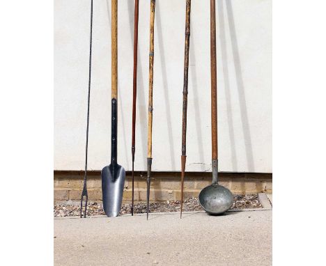 A pair of wrought iron and bamboo whaling harpoons 19th century, 290cm overall, together with assorted whaling tools, (6)Prov