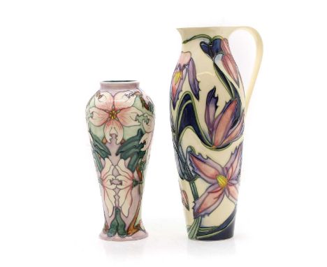 A Moorcroft daffodil jug designed by Phillip Gibson,dated 2004, 27cm hightogether with a Moorcroft Blakeney, dated 2001,21cm 