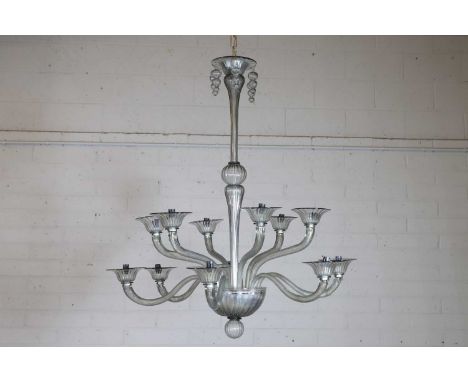 A Murano glass chandelier, of recent manufacture, with fluted and scrolled arms.96cm diameter102cm high to fittingCondition R